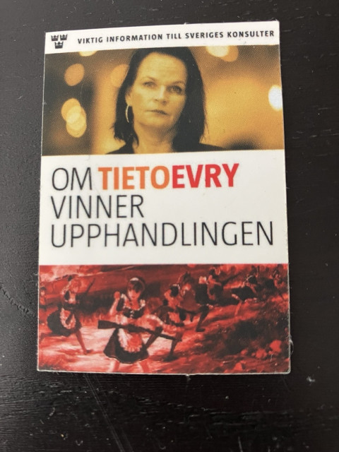 A brochure with a photo of a woman at the top, text in Swedish that translates to "Important information for Sweden's consultants - If TietoEVRY wins the procurement," and an artwork of armed maids in battle at the bottom.