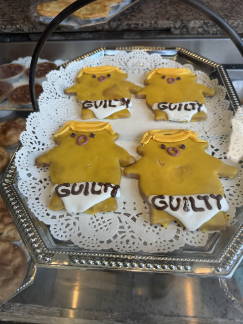 Donald Trump-shaped cookies, wearing diapers with the word “guilty” printed on them.