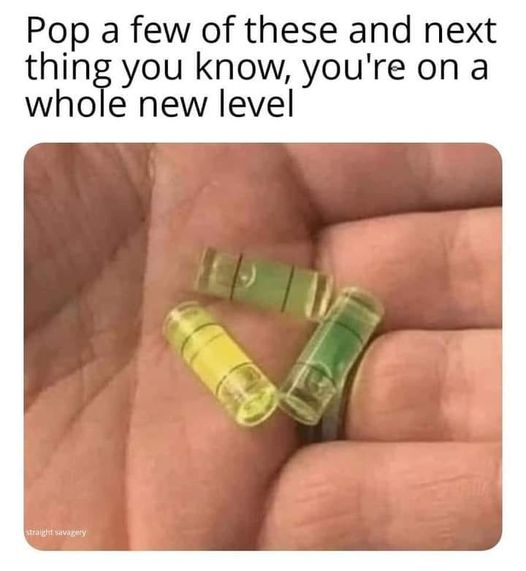 Caption: Pop a few of these and next thing you know, you're on a whole new level
Picture of hand holding bubble level capsuls for a level. 