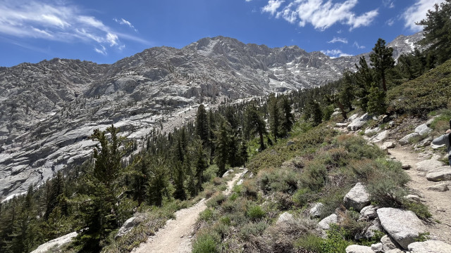 An alpine trail switchback leading up into the mountains