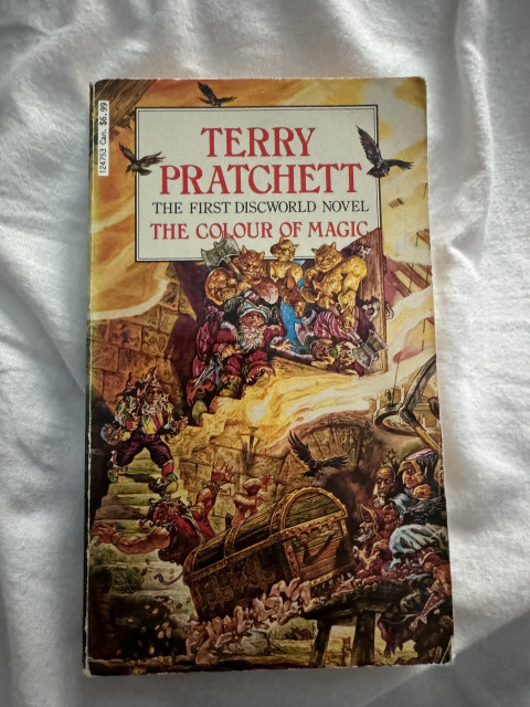Picture the cover of the paperback edition of Terry Pratchett’s ‘The Colour of Magic’