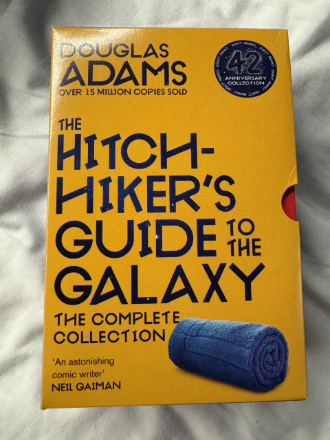 Picture the special edition cover of the 42nd Anniversary collection of the Hitch-hikers guide to Galaxy trilogy (in 5 parts)