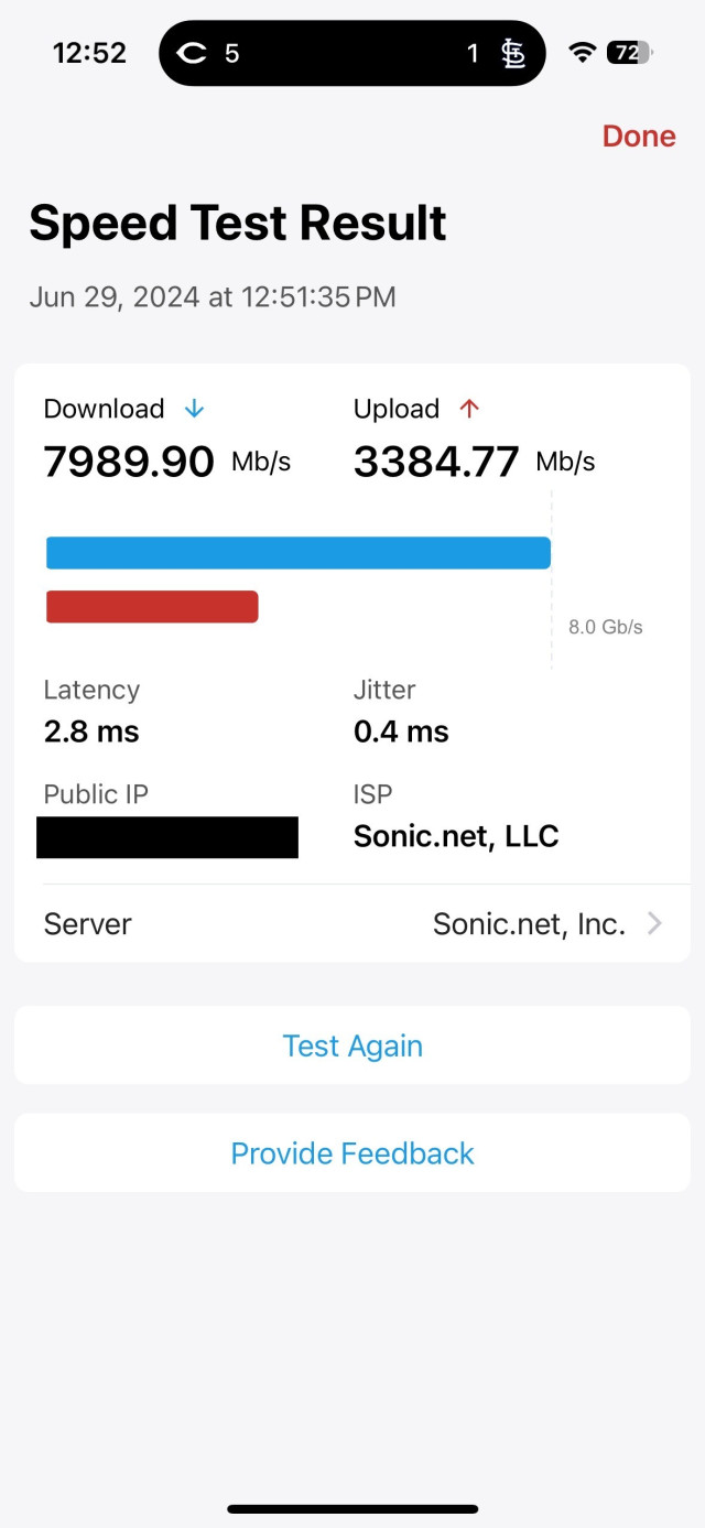 Screen shot of a speed test: 7989.90Mb/s down, 3384.77Mb/s up.