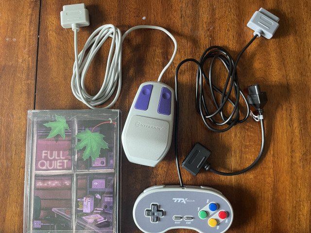 Picture of Hyperkin SNES mouse, Full Quiet Cartridge, aftermarket repro SNES gamepad, and a SNES-to-NES adapter