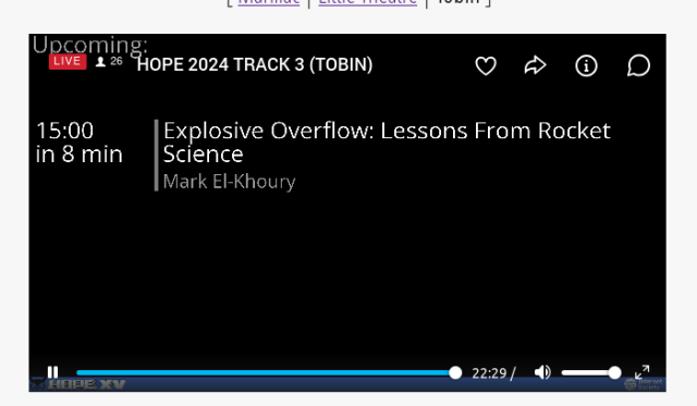 Screenshot of a livestream, showing a typical infobeamer layout, room name, next talk is at 15:00, in 8 minutes, Explosive Overflow: Lessons From Rcket Science by Mark El-Khoury