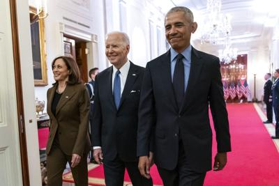 Harris, Biden and Obama walking together