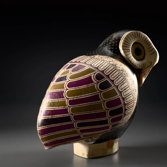 Back and right view of an ancient Greek aryballos in the shape of a tiny owl with ochre, purple and black decor mimicking feathers and white dots on the head. Eyes are round with ochre pupils and surrounded by converging lines. 