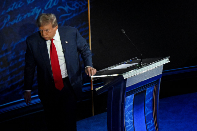 Photo from the debate: a dejected Trump leaves the stage.
