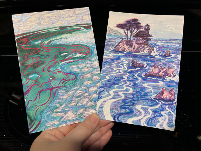 Two pieces of the ocean, shown under direct light to showcase the reflective properties of the ink! One has a green ocean with reflective magenta and purple-blue details, viewed from the shoreline. The other has a lighthouse in an exaggerated, geometric rock hatching way. the ocean has white details including sea spray, and sparkles in the background.