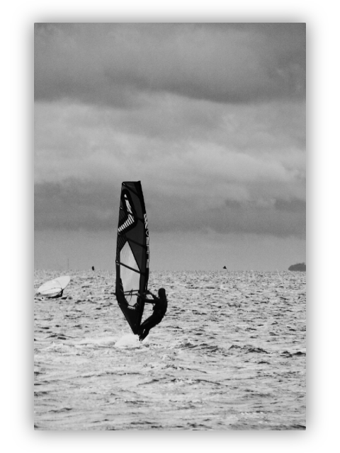 Windsurfer. Heavily overcast sky.