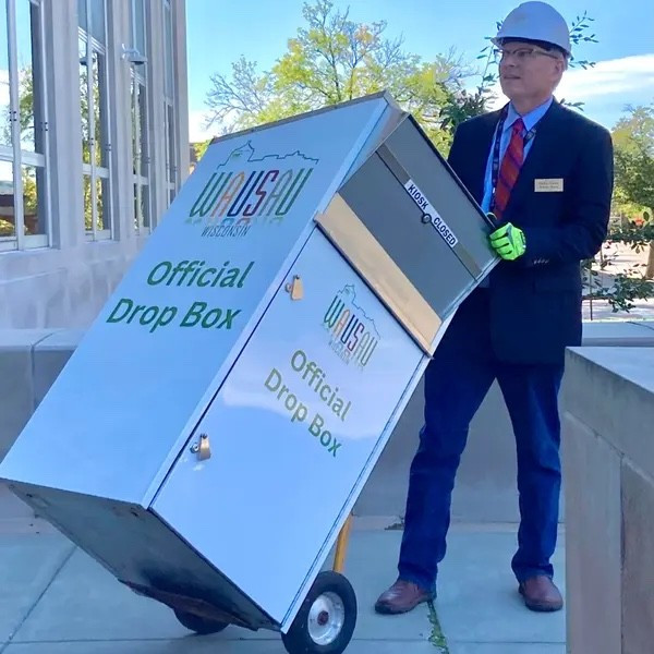 A photo provided by Mayor Doug Diny showing him moving a ballot box in Wausau, Wis.Credit...via Doug Diny