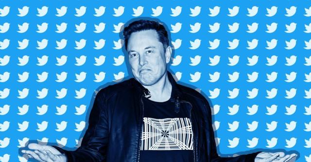 Elon Musk in front of blue background with dozens of twitter logos