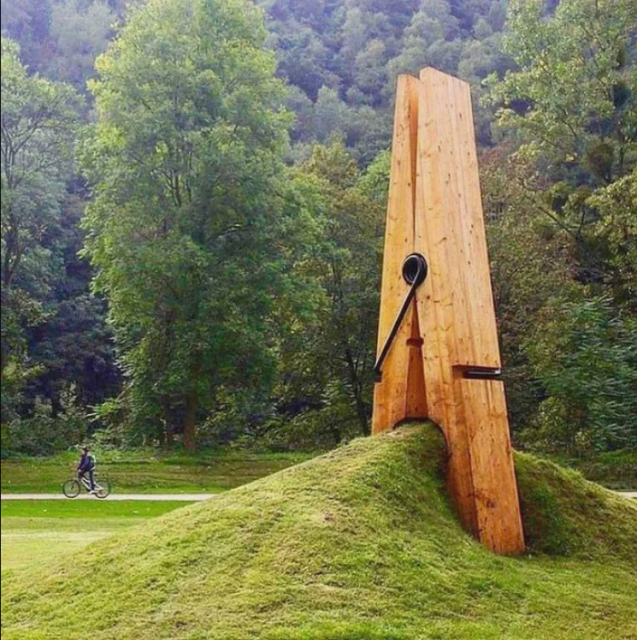 Designed by Turkish artist Mehmet Ali Uysal, this giant clothespin sculpture that seems to be holding onto a mound of dirt and grass, resides on the outskirts of Liege, Belgium