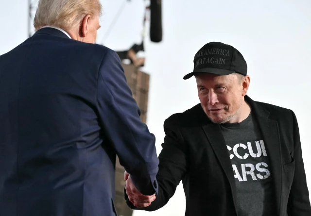 Elon Musk shaking hands with Donald Trump at Trump’s rally in Butler, Pennsylvania