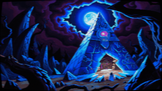 Pixel art of a gargantuan pyramid, its face etched with cerulean veins that pulse with an inner luminescence. The apex glows with a rosy-violet aura emanating from a circular portal, its edges shimmering like captured stardust. Jagged obsidian peaks claw at the indigo sky on either side, framing the monolithic structure in a desolate embrace. Crumbling stone whispers tales of epochs past; fissures scar the pyramid's surface, hinting at forgotten tremors and ancient upheavals. The colossal entrance, though sealed, emits a ghostly luminescence, suggesting a slumbering sentience within. Above, a full moon hangs heavy in a velvet sky bruised with swirling amethyst clouds, casting an ethereal glow upon the scene. Shadows stretch and twist, mimicking the jagged forms of the landscape below. The world is rendered in shades of midnight blue, twilight purple, and starless black, a symphony of hues that speaks of cosmic mysteries and forgotten realms. The image has a CRT filter applied.