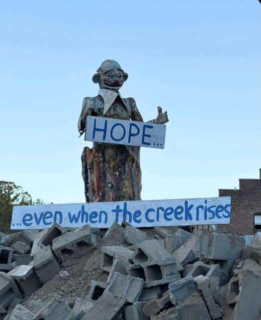 Asheville River arts district hope statue created from rubble