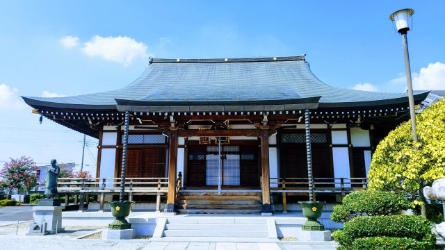 A wide Buddhist temple built in wood.