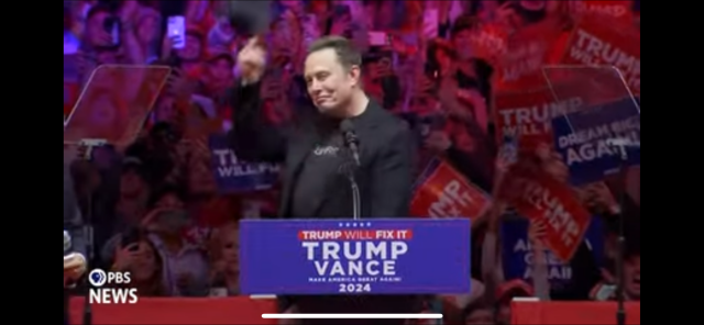 Elon musk salutes the audience with his cap at Madison Square Garden Trump/Vance rally.