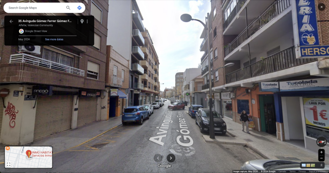 A google street view of the affected street 35 Avinguda Gómez Ferrer in Sedavi, Valencia, Spain shows a quiet narrow street with cars parked along each side. A blue vertical sign is in the top right corner.