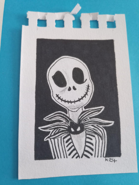 A cartoon sketch of jack Skellington, a skeleton with a large head, grinning smile wearing a black and white suit