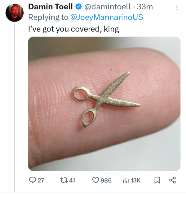 Finger with tiny scissors.