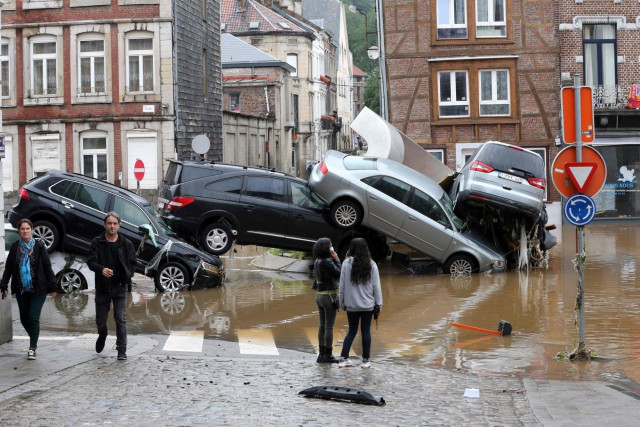 A photo of a pile of cars stacked by major floods in Belgium. (Photo: Francois Valschaerts/AFP/Getty)