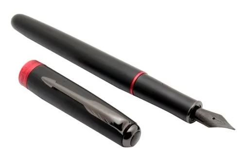 A fountain pen and its cap. The pen is black, with a black nib and a red band. The cap is black and has a red band at the base. 