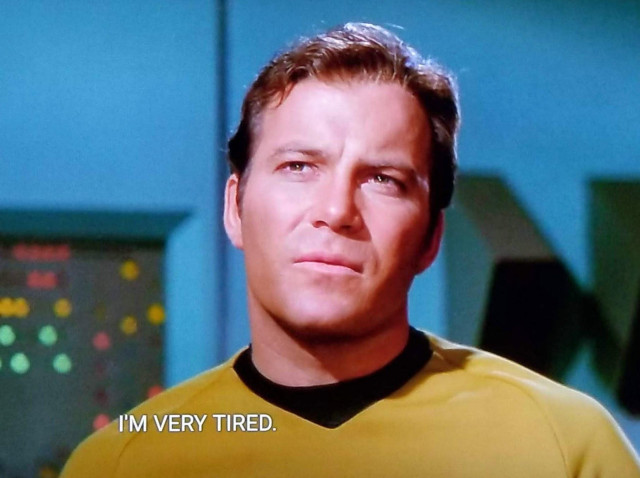 TOS scene. Kirk is standing on the enterprise with some green and yellow and red bleeps and bloops in the background looking up and pondering. 
Closed caption reads, "I'm very tired." 