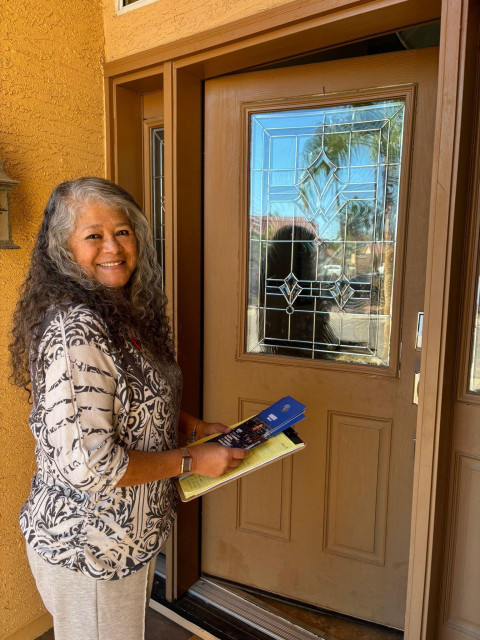 UFW President Teresa Romero at a voter's door in Arizona where she is going door to door to get out the vote