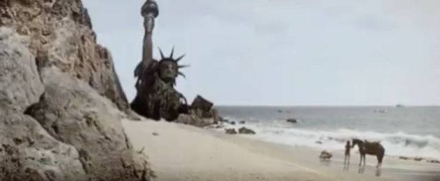 Statue of Liberty half buried on a beach - scene from Planet of the Apes.