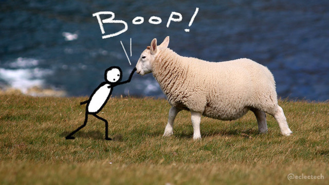 A photo of a young sheep in profile, facing left, standing on a grassy clifftop with the sea beyond. A simple drawn figure stands in front of them and is leaning forward to boop them on the nose. The work BOOP! is scribbled above.