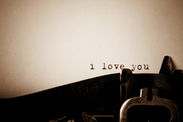 closeup of a type writer and on the paper the words "i love you"