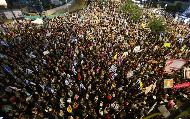 Aerial shot of thousands of protestors outside the IDF headquarters in Tel Aviv Israel.