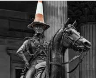 Duke of Wellington statue in Glasgow Scotland wears a traffic cone hat, expression of Glaswegian attitude!