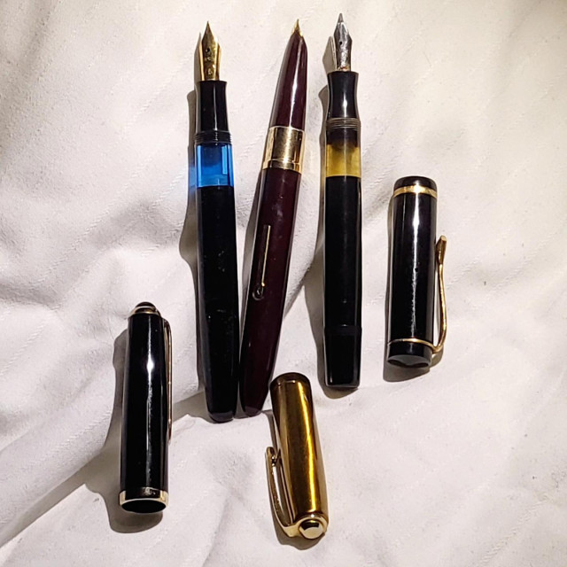 The same pens, with their caps removed