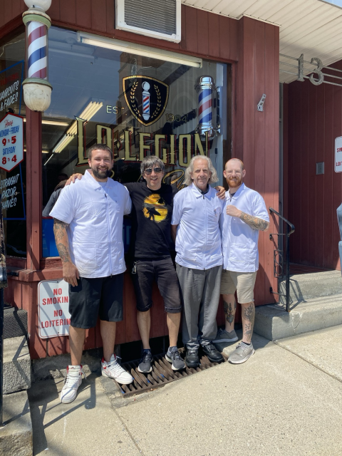 Me and the shop owners posing for a group picture