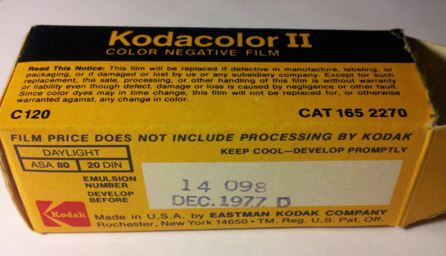 An opened box of Kodacolor II film. The expiration date stamped on the side says December 1977. This roll was found among things that I was given after my grandfather died. The package has been opened but the film was unexposed.