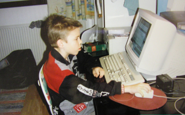 Me in the 90s sitting on a computer