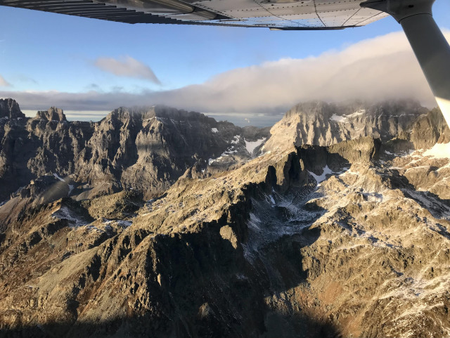 Sun shines on a mountain flank high in the Alps.