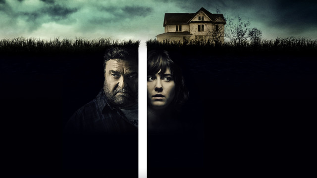 John Goodman and Mary Elizabeth Winstead. Split with a lone. Above them is a cornfield and a house. Dark skies. 