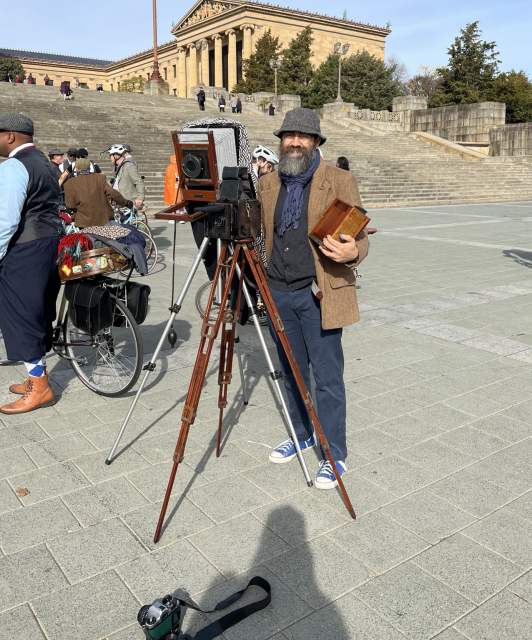 A cell phone photo of me posing with my gear (3 large format cameras). In front of the museum. 