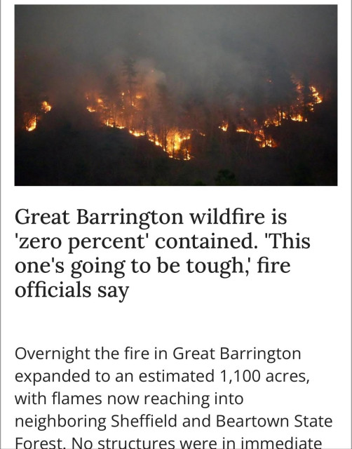 Clip from a news article. The photograph is an outline of a burning wildfire. The text says:
Great Barrington wildfire is
'zero percent' contained. 'This
one's going to be tough, fire
officials say.

Overnight the fire in Great Barrington
expanded to an estimated 1,100 acres, with flames now reaching into
neighboring Sheffield and Beartown State
Forest. No structures were in immediate