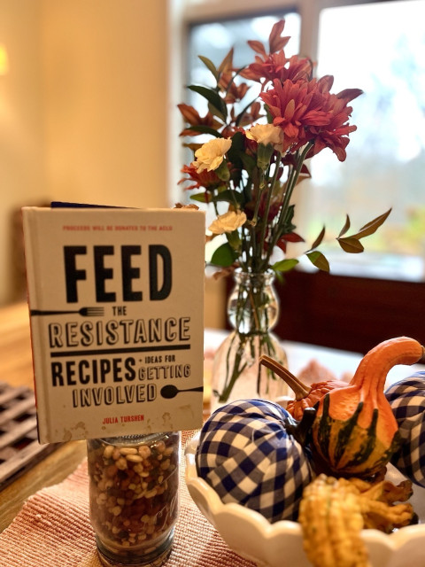 Autumn Tablescape for fundraiser for a candidate. Feed the Resistance cookbook by ACLU, flowers, gourds