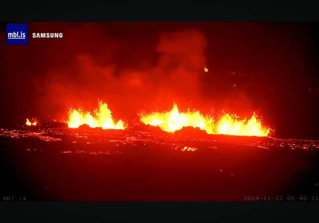 Screenshot from mbl live stream. Lava fountains and lava in the darkness. Timestamp 2024-11-22 05:46:21z.