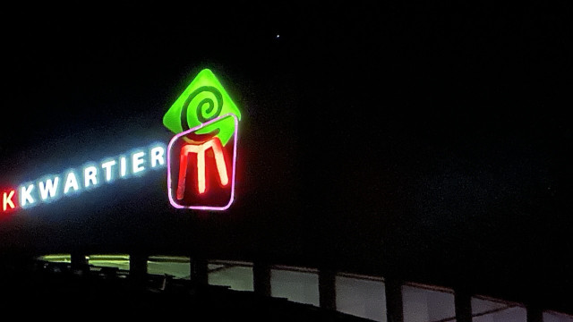 Logo on top of building 