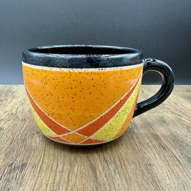 Orange and black geometric cup