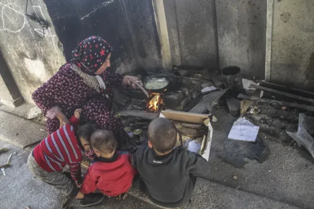 Zaanin, who is also a cancer patient, walks long distances to find firewood and other items she salvages to help care for her children [Mahmoud İssa/Anadolu]