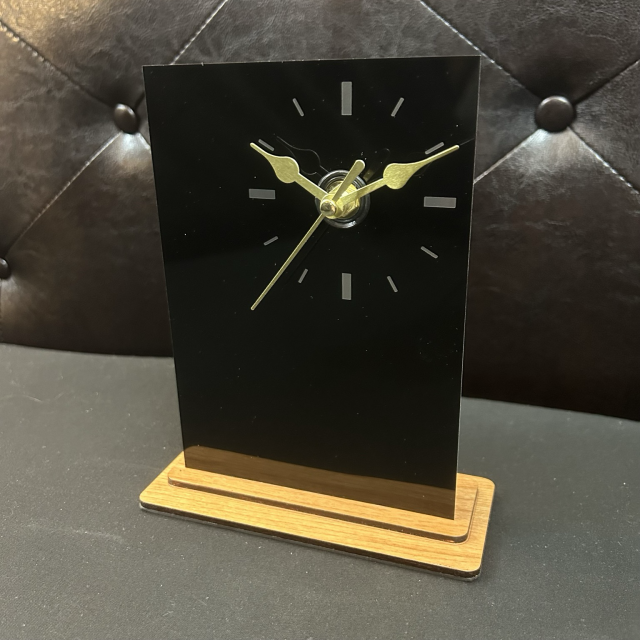 Monolith clock black anodized aluminum seen from above right