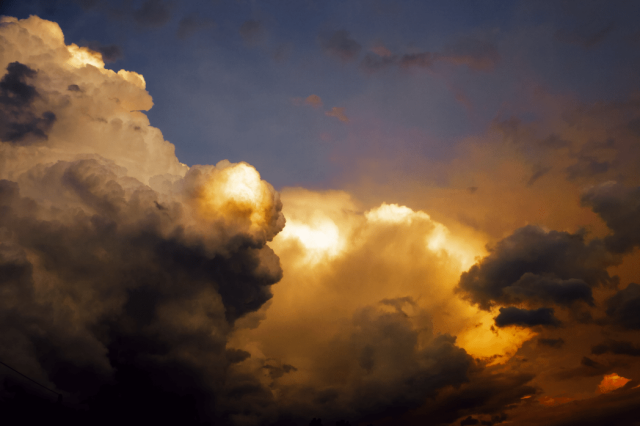 Formidable clouds caught red-handed blazing skies and hearts.