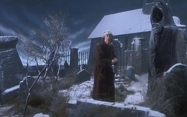 Scrooge and the Ghost of Christmas Yet to Come in the cemetery, from 'The Muppet Christmas Carol.'